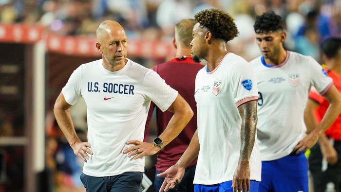 Jul 1, 2024; Kansas City, Missouri, USA; United States head coach Gregg Berhalter talks with midfielder Weston McKennie (8) during the second half of a Copa America match against Uruguay at Arrowhead Stadium. Mandatory Credit: Jay Biggerstaff-USA TODAY Sports