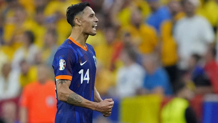 Soccer Football - Euro 2024 - Round of 16 - Romania v Netherlands - Munich Football Arena, Munich, Germany - July 2, 2024 Netherlands Tijjani Reijnders reacts after Donyell Malen scores their third goal REUTERS/Fiona Noever