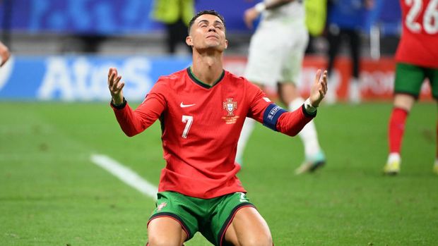 FRANKFURT, GERMANY - JULY 01: Cristiano Ronaldo of Portugal reacts during the UEFA EURO 2024 round of 16 match between Portugal and Slovenia at Deutsche Bank Park in Frankfurt, Germany on July 1, 2024. (Photo by Gokhan Balci/Anadolu via Getty Images)