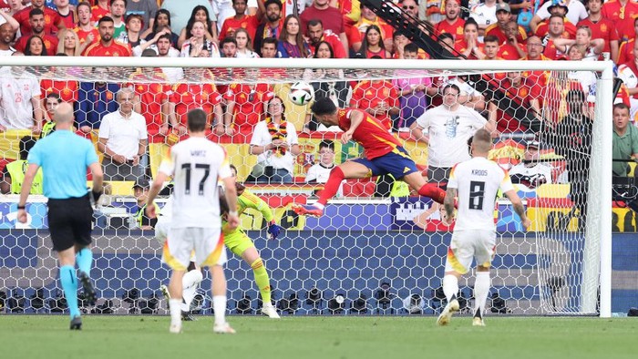 STUTTGART, GERMANY - JULY 05: Mikel Merino of Spain scores his teams second goal with a header as Manuel Neuer of Germany (obscured) fails to make a save during the UEFA EURO 2024 quarter-final match between Spain and Germany at Stuttgart Arena on July 05, 2024 in Stuttgart, Germany. (Photo by Alexander Hassenstein/Getty Images)