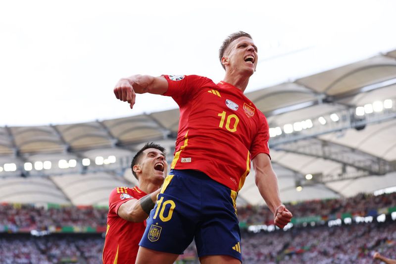 STUTTGART, GERMANY - JULY 05: Dani Olmo of Spain celebrates scoring his team's first goal with teammate Alvaro Morata during the UEFA EURO 2024 quarter-final match between Spain and Germany at Stuttgart Arena on July 05, 2024 in Stuttgart, Germany. (Photo by Alex Livesey/Getty Images)