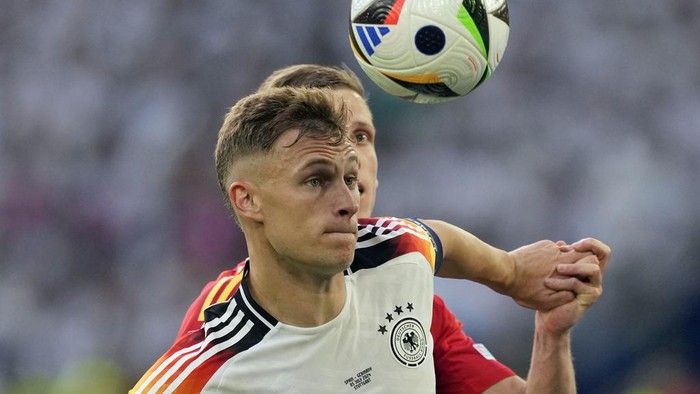 Joshua Kimmich Germanys Joshua Kimmich, front, and Spains Dani Olmo battle for the ball during a quarterfinal match between Germany and Spain at the Euro 2024 soccer tournament in Stuttgart, Germany, Friday, July 5, 2024. (AP Photo/Antonio Calanni)