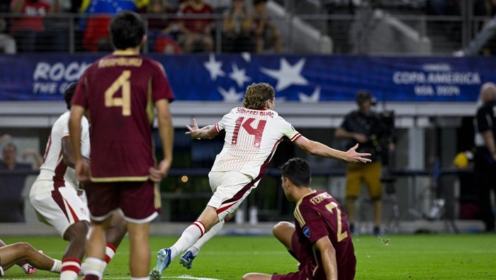 Jul 5, 2024; Arlington, TX, USA; Canada forward Jacob Shaffelburg (14) celebrates after he scores goal against Venezuela during the first half in the 2024 Copa America quarterfinal at AT&T Stadium. Mandatory Credit: Jerome Miron-USA TODAY Sports
