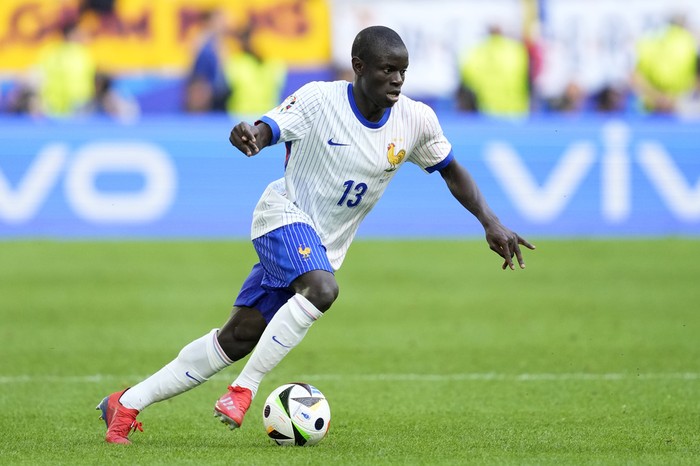 NGolo Kante of France runs with the ball during a round of sixteen match between France and Belgium at the Euro 2024 soccer tournament in Duesseldorf, Germany, Monday, July 1, 2024. (AP Photo/Darko Vojinovic)