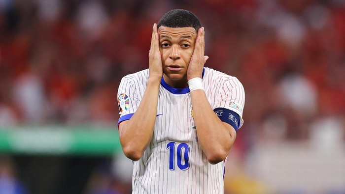 MUNICH, GERMANY - JULY 09: Kylian Mbappe of France looks dejected after the UEFA EURO 2024 semi-final match between Spain v France at Munich Football Arena on July 09, 2024 in Munich, Germany. (Photo by James Gill - Danehouse/Getty Images)