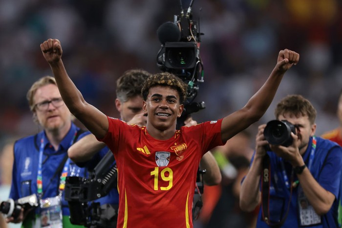 Lamine Yamal MUNICH, GERMANY - JULY 09: Lamine Yamal of Spain celebrates the 2-1 victory and passage to the final following the final whistle of the UEFA EURO 2024 semi-final match between Spain v France at Munich Football Arena on July 09, 2024 in Munich, Germany. (Photo by Jonathan Moscrop/Getty Images)