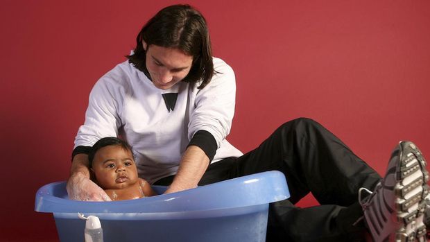 This photo taken in Sept. 2007 shows a 20-year-old Lionel Messi, who had embarked on his legendary Barcelona career just over four years prior, helping to bathe Lamine Yamal, who was merely six months old at the time during a photo session in the dressing room of the Camp Nou stadium in Barcelona, Spain. Lamine Yamal is now a soccer sensation for both Spain and Barcelona and he is still only 16-years-old. (AP Photo/Joan Monfort)