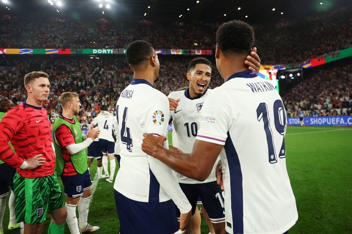 DORTMUND, GERMANY - JULY 10: Ezri Konsa, Jude Bellingham and Ollie Watkins of England celebrate after the teams victory in the UEFA EURO 2024 semi-final match between Netherlands and England at Football Stadium Dortmund on July 10, 2024 in Dortmund, Germany. (Photo by Eddie Keogh - The FA/The FA via Getty Images)