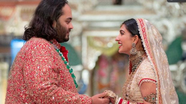 Anant Ambani, son of Indian billionaire Mukesh Ambani, and Radhika Merchant, daughter of industrialist Viren Merchant, react during their wedding celebrations in Mumbai, India, July 12, 2024. Reliance Industries/Handout via REUTERS THIS IMAGE HAS BEEN SUPPLIED BY A THIRD PARTY. NO RESALES. NO ARCHIVES.