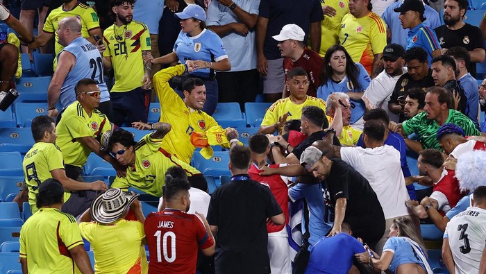 CHARLOTTE, NORTH CAROLINA - JULY 10: Fans of Colombia fight with fans of Uruguay after the CONMEBOL Copa America 2024 semifinal match between Uruguay and Colombia at Bank of America Stadium on July 10, 2024 in Charlotte, North Carolina. (Photo by Tim Nwachukwu/Getty Images)