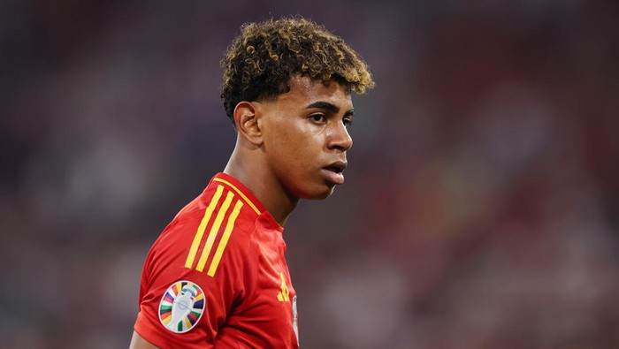 MUNICH, GERMANY - JULY 09: Lamine Yamal of Spain looks on during the UEFA EURO 2024 Semi-Final match between Spain and France at Munich Football Arena on July 09, 2024 in Munich, Germany. (Photo by Alex Grimm/Getty Images)
