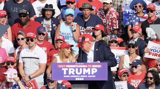 Republican presidential candidate and former U.S. President Donald Trump is assisted by the Secret Service after gunfire rang out during a campaign rally at the Butler Farm Show in Butler, Pennsylvania, U.S., July 13, 2024. REUTERS/Brendan McDermid