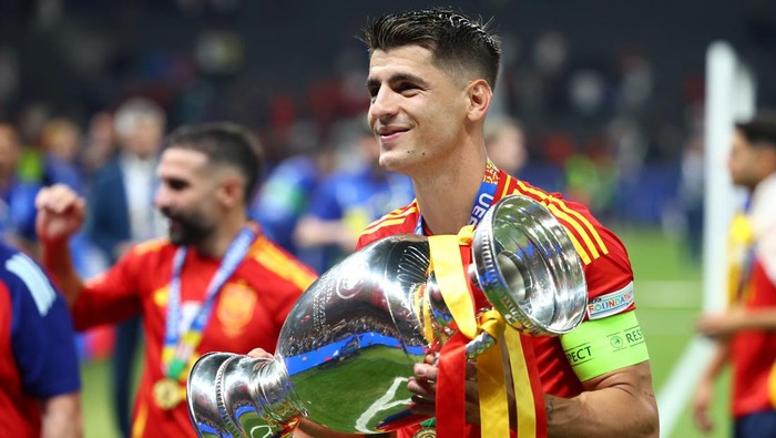 BERLIN, GERMANY - JULY 14:   Alvaro Morata of Spain celebrates with the trophy at the end of the UEFA EURO 2024 final match between Spain and England at Olympiastadion on July 14, 2024 in Berlin, Germany. (Photo by Chris Brunskill/Fantasista/Getty Images)