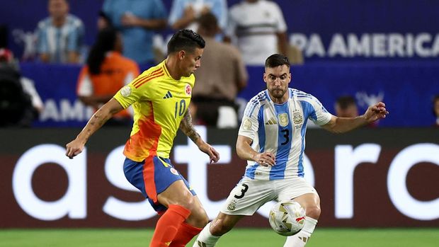 Soccer Football - Copa America 2024 - Final - Argentina v Colombia - Hard Rock Stadium, Miami, Florida, United States - July 14, 2024 Colombia's James Rodriguez in action with Argentina's Nicolas Tagliafico REUTERS/Agustin Marcarian
