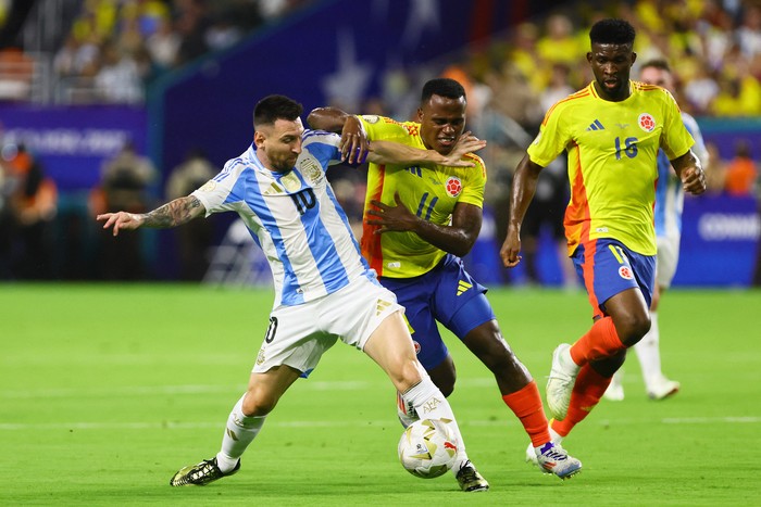 Jul 14, 2024; Miami, FL, USA; Argentina forward Lionel Messi (10) and Colombia midfielder Jhon Arias (11) battle for possession during the first half of the Copa America final at Hard Rock Stadium. Mandatory Credit: Sam Navarro-USA TODAY Sports