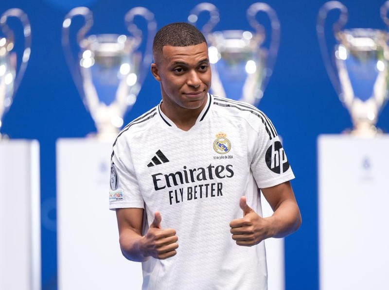 MADRID, SPAIN - JULY 16: Real Madrid new signing, Kylian Mbappe is unveiled at Estadio Santiago Bernabeu on July 16, 2024 in Madrid, Spain. (Photo by David Ramos/Getty Images)