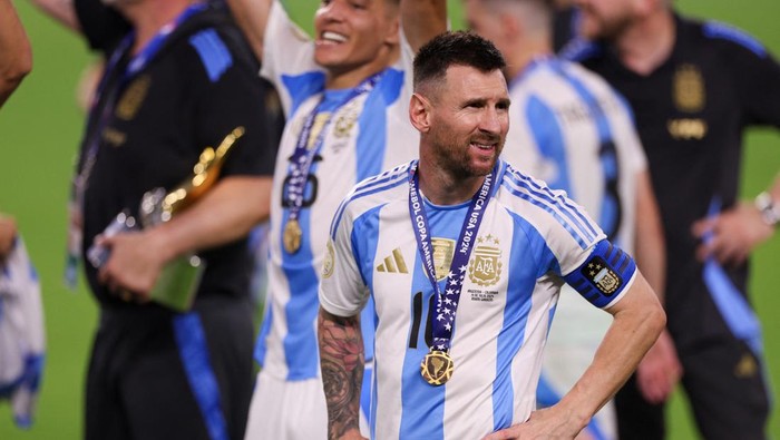 Jul 14, 2024; Miami, FL, USA;  Argentina forward Lionel Messi (10) celebrates after winning the Copa America Final against Colombia at Hard Rock Stadium. Mandatory Credit: Nathan Ray Seebeck-USA TODAY Sports