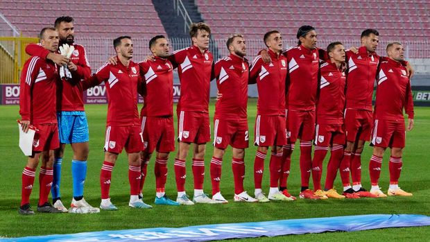 TA' QALI, MALTA - SEPTEMBER 06:  Soccer players from the Gibraltar national soccer team listen to their country's national anthem ahead of the international friendly soccer match 2024 between Malta and Gibraltar at the National Stadium, on September 06, 2023, in Ta' Qali, Malta.  (Photo by Domenic Aquilina/NurPhoto via Getty Images)