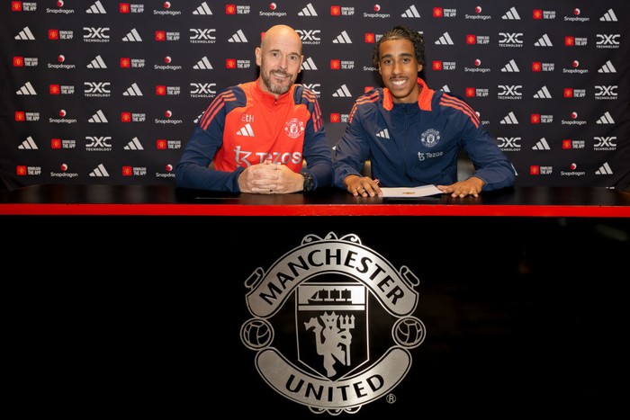 MANCHESTER, ENGLAND - JULY 18: (EXCLUSIVE COVERAGE) Leny Yoro of Manchester United poses with Manager Erik ten Hag after signing for the club at Carrington Training Ground on July 18, 2024 in Manchester, England.  (Photo by Manchester United/Manchester United via Getty Images)