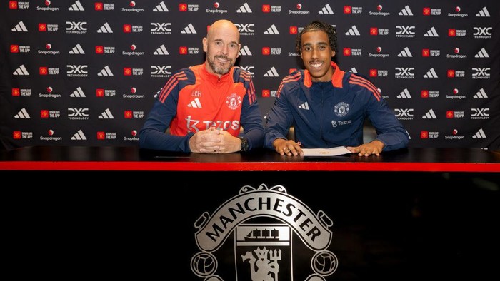 MANCHESTER, ENGLAND - JULY 18: (EXCLUSIVE COVERAGE) Leny Yoro of Manchester United poses with Manager Erik ten Hag after signing for the club at Carrington Training Ground on July 18, 2024 in Manchester, England.  (Photo by Manchester United/Manchester United via Getty Images)