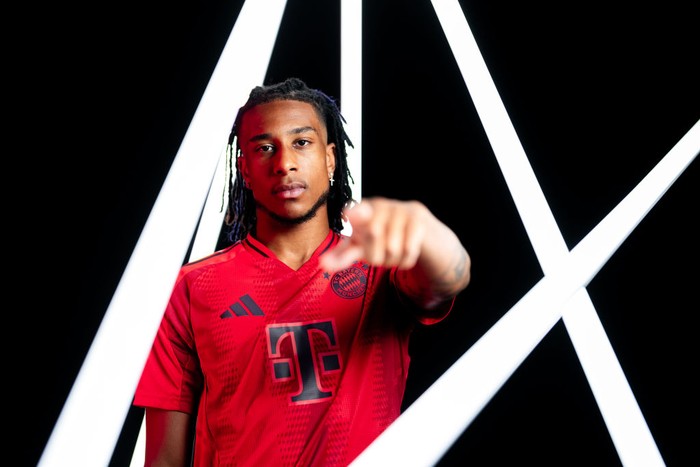 MUNICH, GERMANY - JULY 07: Michael Olise poses as he signs a contract with FC Bayern München on July 07, 2024 in Munich, Germany. The 22-year-old forward moves to Munich from English Premier League club Crystal Palace on a five-year contract valid through to 30 June 2029. (Photo by F. Noever/FC Bayern via Getty Images)