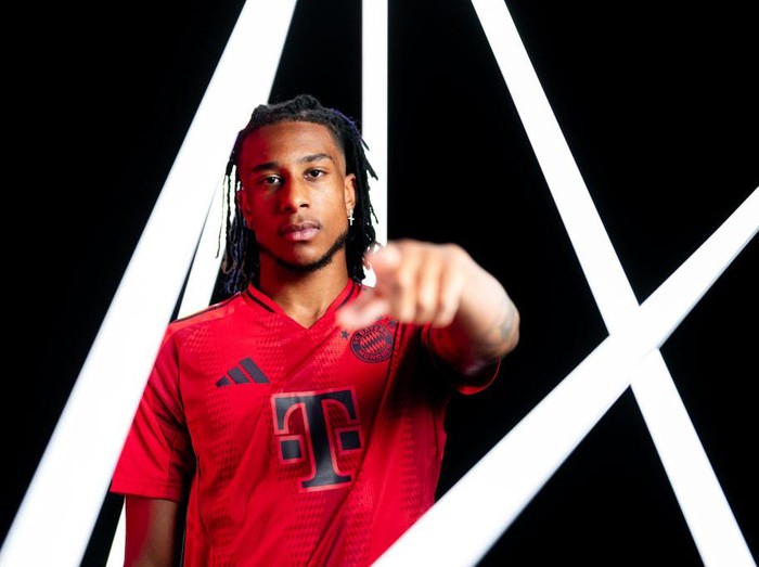 MUNICH, GERMANY - JULY 07: Michael Olise poses as he signs a contract with FC Bayern München on July 07, 2024 in Munich, Germany. The 22-year-old forward moves to Munich from English Premier League club Crystal Palace on a five-year contract valid through to 30 June 2029. (Photo by F. Noever/FC Bayern via Getty Images)