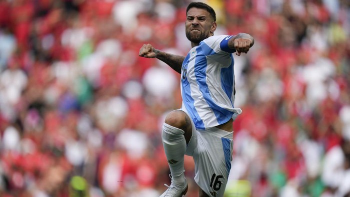 Argentinas Nicolas Otamendi celebrates his sides second goal scored by Cristian Medina during the mens Group B soccer match between Argentina and Morocco at Geoffroy-Guichard Stadium at the 2024 Summer Olympics, Wednesday, July 24, 2024, in Saint-Etienne, France. The goal was disallowed by VAR for offside. (AP Photo/Silvia Izquierdo)