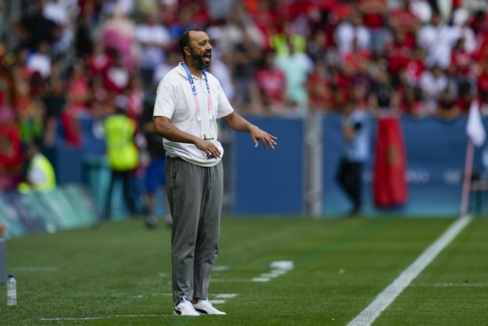 Moroccos coach Tarik Sektioui reacts during the mens Group B soccer match between Argentina and Morocco at Geoffroy-Guichard Stadium at the 2024 Summer Olympics, Wednesday, July 24, 2024, in Saint-Etienne, France. (AP Photo/Silvia Izquierdo)