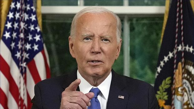 US President Joe Biden speaks during an address to the nation about his decision to not seek reelection, in the Oval Office at the White House in Washington, DC, on July 24, 2024. US President Joe Biden will give an Oval Office speech July 24, 2024 to explain his historic decision to drop out of the 2024 election and pass the torch to Kamala Harris, with the White House denying any cover up over his health. In his first address to the nation since quitting the race, the 81-year-old is expected to burnish his legacy and deny he will spend six months as a lame duck president. (Photo by Evan Vucci / POOL / AFP)