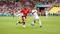 NANTES, FRANCE - JULY 27:  Zizo #14 of Team Egypt battles for possession with Zafarmurod Abdirakhmatov #13 of Team Uzbekistan during the Mens group C match between Uzbekistan and Dominican Republic during the Olympic Games Paris 2024 at Stade de la Beaujoire on July 27, 2024 in Nantes, France. (Photo by Robert Cianflone/Getty Images)