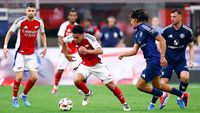 INGLEWOOD, CALIFORNIA - JULY 27:  Ethan Nwaneri #53 of Arsenal controls the ball against Hannibal Mejbri #46 of Manchester United in the first half during a pre-season friendly match at SoFi Stadium on July 27, 2024 in Inglewood, California.  (Photo by Ronald Martinez/Getty Images)