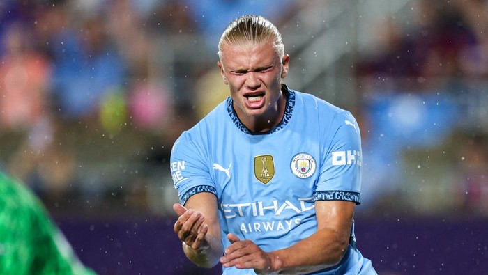 Jul 30, 2024; Orlando, FL, USA;  Manchester City forward Erling Haaland (9) reacts after shot against Barcelona in the first half during a Champions Tour friendly match at Camping World Stadium. Mandatory Credit: Nathan Ray Seebeck-USA TODAY Sports