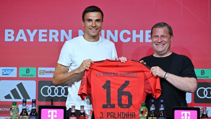 Joao Palhinha MUNICH, GERMANY - JULY 30: New Signing Joao Palhinha poses with his jersey and Max Eberl, Sporting Director of Bayern Munich during a press conference after signing with FC Bayern Munich at Allianz Arena on July 30, 2024 in Munich, Germany. The Portugal international joins on a four-year contract valid through to June 2028. (Photo by Sebastian Widmann/Getty Images)