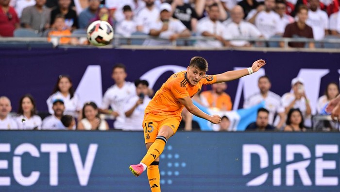 Jul 31, 2024; Chicago, IL, USA; Real Madrid midfielder Arda Guler (15) shoots the ball against AC Milan during the first half at Soldier Field. Mandatory Credit: Daniel Bartel-USA TODAY Sports