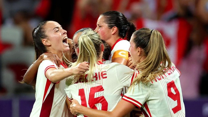 NICE, FRANCE - JULY 31: Vanessa Gilles #14 of Team Canada celebrates scoring her teams first goal during the Womens group A match between Colombia and Canada during the Olympic Games Paris 2024 at Stade de Nice on July 31, 2024 in Nice, France. (Photo by Marc Atkins/Getty Images)