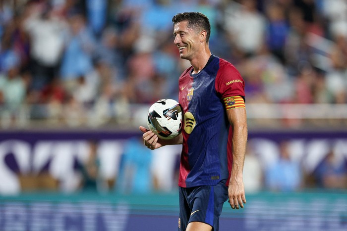 Jul 30, 2024; Orlando, FL, USA; Barcelona forward Robert Lewandowski (9) gets ready to take a penalty kick in a tie breaker during a Champions Tour friendly match against Manchester City at Camping World Stadium. Mandatory Credit: Nathan Ray Seebeck-USA TODAY Sports
