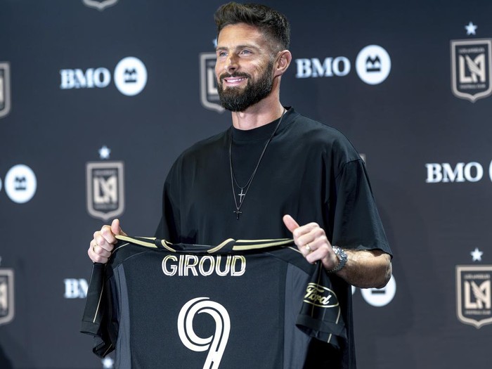 French forward Olivier Giroud is introduced to Los Angeles FC fans during a press conference at the InterContinental Hotel in Los Angeles, Thursday, Aug. 1, 2024. Giroud holds his first press conference with Los Angeles FC since announcing in May he would sign with the Major League Soccer club.  (David Crane/The Orange County Register via AP)