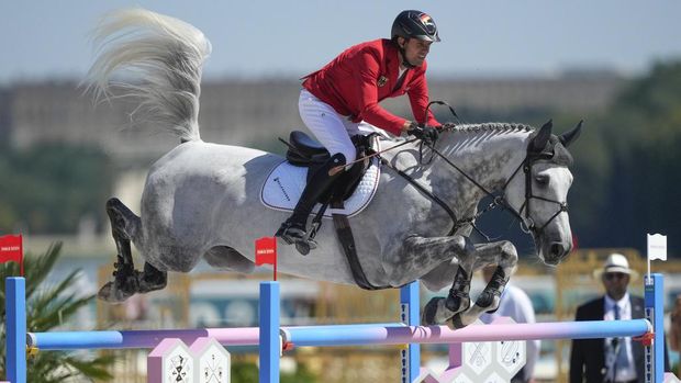 Germany's Christian Kukuk, riding Checker 47, during the Equestrian Jumping qualifiers, at the 2024 Summer Olympics, Monday, Aug. 5, 2024, in Versailles, France. (AP Photo/Mosa'ab Elshamy)