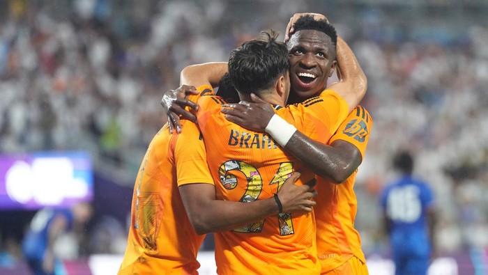 CHARLOTTE, NORTH CAROLINA - AUGUST 06: Vinicius Paixao de Oliveira Junior #7 celebrates a goal by Brahim #21 of Real Madrid during a pre-season friendly match against Chelsea at Bank of America Stadium on August 06, 2024 in Charlotte, North Carolina. (Photo by Grant Halverson/Getty Images)