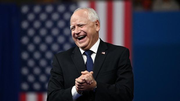 US Democratic vice presidential candidate Minnesota Gorvernor Tim Walz reacts as Vice President and 2024 Democratic presidential candidate Kamala Harris speaks at Temple University's Liacouras Center in Philadelphia, Pennsylvania, August 6, 2024, on the first day of their 