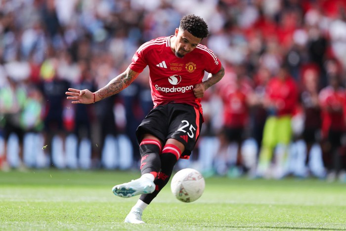 LONDON, ENGLAND - AUGUST 10: Jadon Sancho of Manchester United takes a penalty to see it saved by Ederson Moraes of Manchester City during the penalty shootout during the 2024 FA Community Shield match between Manchester United and Manchester City  at Wembley Stadium on August 10, 2024 in London, England. (Photo by James Gill - Danehouse/Getty Images)