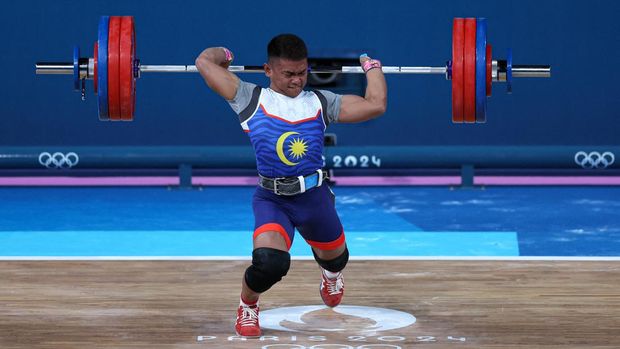 Paris 2024 Olympics - Weightlifting - Men's 61kg - South Paris Arena 6, Paris, France - August 07, 2024.  Mohamad Aniq Bin Kasdan of Malaysia in action. REUTERS/Amanda Perobelli