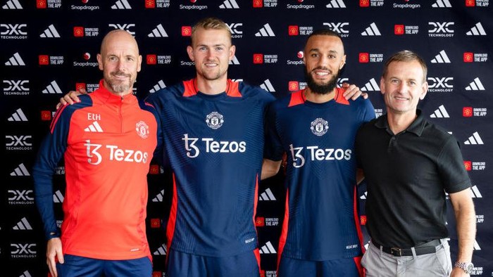 MANCHESTER, ENGLAND - AUGUST 13: (EXCLUSIVE COVERAGE) Matthijs de Ligt and Noussair Mazraoui of Manchester United pose with Manager Erik ten Hag and Sporting Director Dan Ashworth  after signing for the club at Carrington Training Ground on August 13, 2024 in Manchester, England.  (Photo by Manchester United/Manchester United via Getty Images)