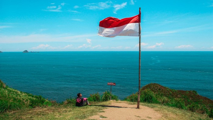 Ilustrasi Bendera Merah Putih Ilustrasi bendera Merah Putih sedang berkibar