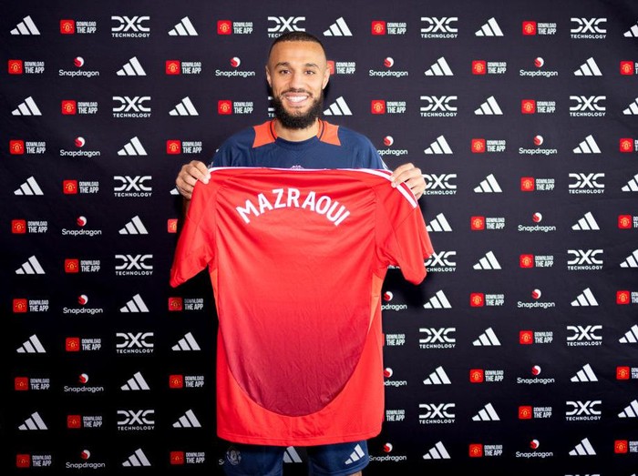 MANCHESTER, ENGLAND - AUGUST 13: (EXCLUSIVE COVERAGE) Noussair Mazraoui of Manchester United poses after signing for the club at Carrington Training Ground on August 13, 2024 in Manchester, England.  (Photo by Manchester United/Manchester United via Getty Images)