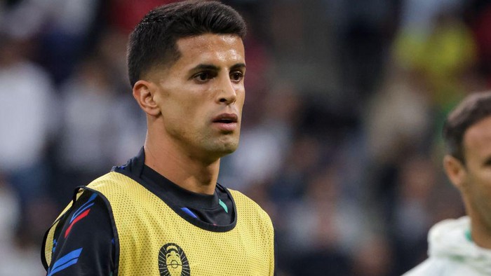 HAMBURG, GERMANY - JULY 05: Joao Cancelo of Portugal warming up before the UEFA EURO 2024 quarter-final match between Portugal and France at Volksparkstadion on July 05, 2024 in Hamburg, Germany. (Photo by Inaki Esnaola/Getty Images)