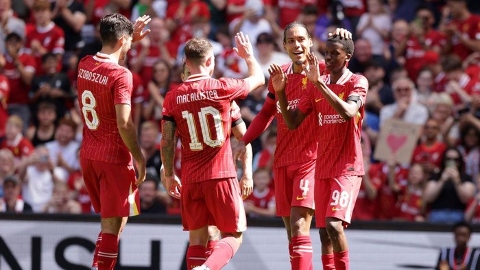 LIVERPOOL, ENGLAND - AUGUST 11: Liverpools Trey Nyoni (R) celebrates scoring the 4th goal against Sevilla with his team mates during the Pre-Season Friendly between Liverpool and Sevilla, at Anfield on August 11, 2024 in Liverpool, England. (Photo by Barrington Coombs/Getty Images)