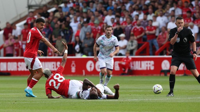 NOTTINGHAM, ENGLAND - AUGUST 17:  AFC Bournemouths Antoine Semenyo is fouled by Nottingham Forests Danilo, both players lie injured and have to be substituted during the Premier League match between Nottingham Forest FC and AFC Bournemouth at City Ground on August 17, 2024 in Nottingham, England. (Photo by Stephen White - CameraSport via Getty Images)
