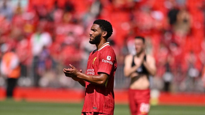 LIVERPOOL, ENGLAND - AUGUST 11: (THE SUN OUT, THE SUN ON SUNDAY OUT) Joe Gomez of Liverpool showing his appreciation to the fans at the end of the pre-season friendly match between Liverpool and Sevilla at Anfield on August 11, 2024 in Liverpool, England. (Photo by Andrew Powell/Liverpool FC via Getty Images)