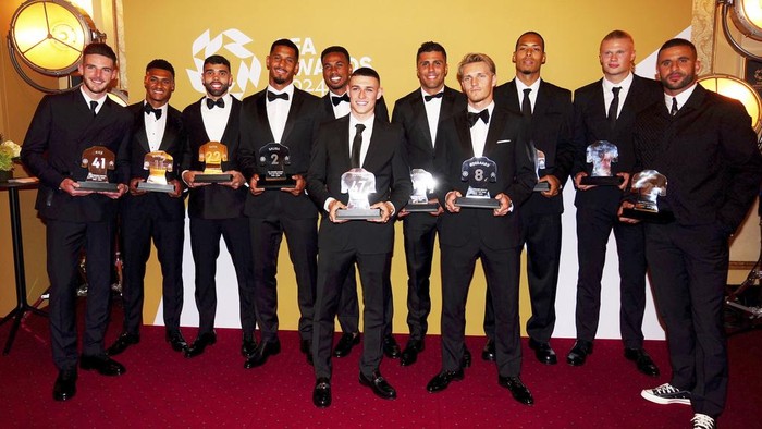 Phil Foden poses after winning the PFA Players' Player of the Year award during the 2024 PFA Awards at the Opera House Manchester, England, Tuesday Aug. 20, 2024. (Peter Byrne/PA via AP)